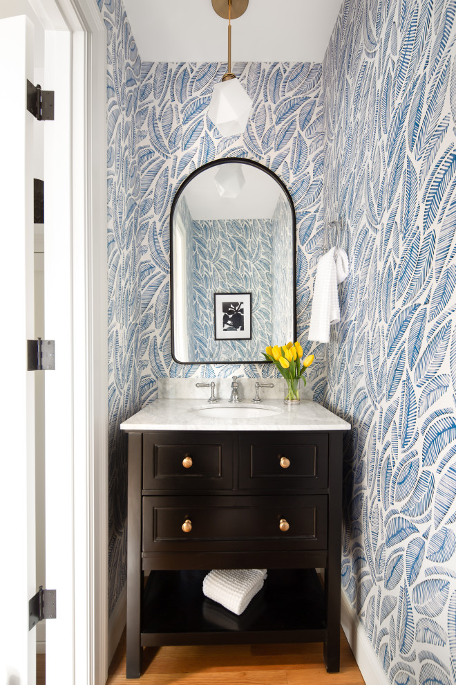 Inspiration for a classic cloakroom in Seattle with raised-panel cabinets, black cabinets, blue tiles, white worktops, a freestanding vanity unit, wallpapered walls and onyx worktops.