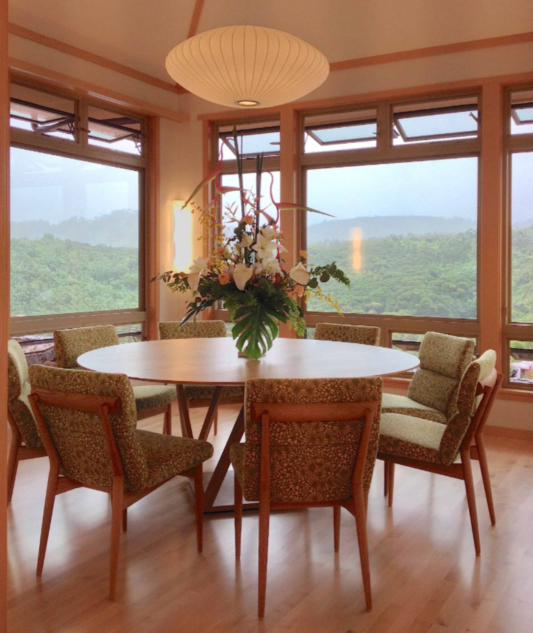 Photo of a large asian dining room in Hawaii with beige walls, bamboo floors and beige floor.