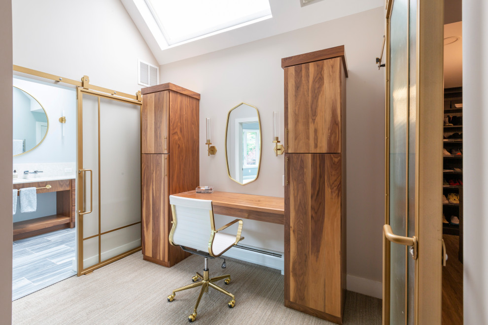 This is an example of a large contemporary ensuite bathroom in New York with flat-panel cabinets, medium wood cabinets, an alcove bath, an alcove shower, a one-piece toilet, multi-coloured tiles, porcelain tiles, porcelain flooring, engineered stone worktops, grey floors, a hinged door, white worktops, a wall niche, a single sink, a built in vanity unit and a trough sink.