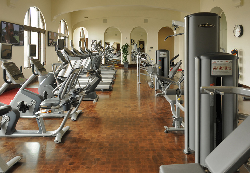 Photo of a large mediterranean multipurpose gym in San Francisco with medium hardwood floors.