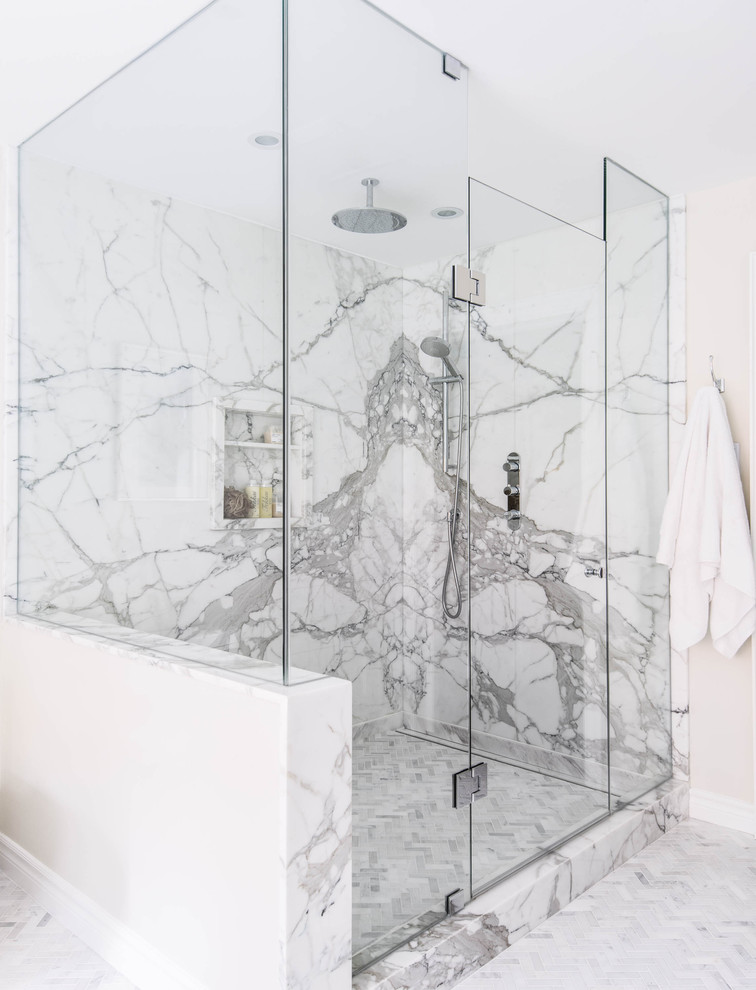 Large transitional master bathroom in Toronto with an undermount sink, beaded inset cabinets, white cabinets, marble benchtops, a freestanding tub, a corner shower, a one-piece toilet, multi-coloured tile, stone slab, white walls, marble floors, white floor and a hinged shower door.