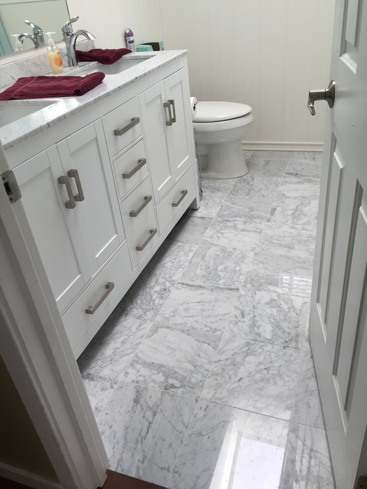 Inspiration for a small traditional bathroom in Seattle with white tile, ceramic tile and marble floors.