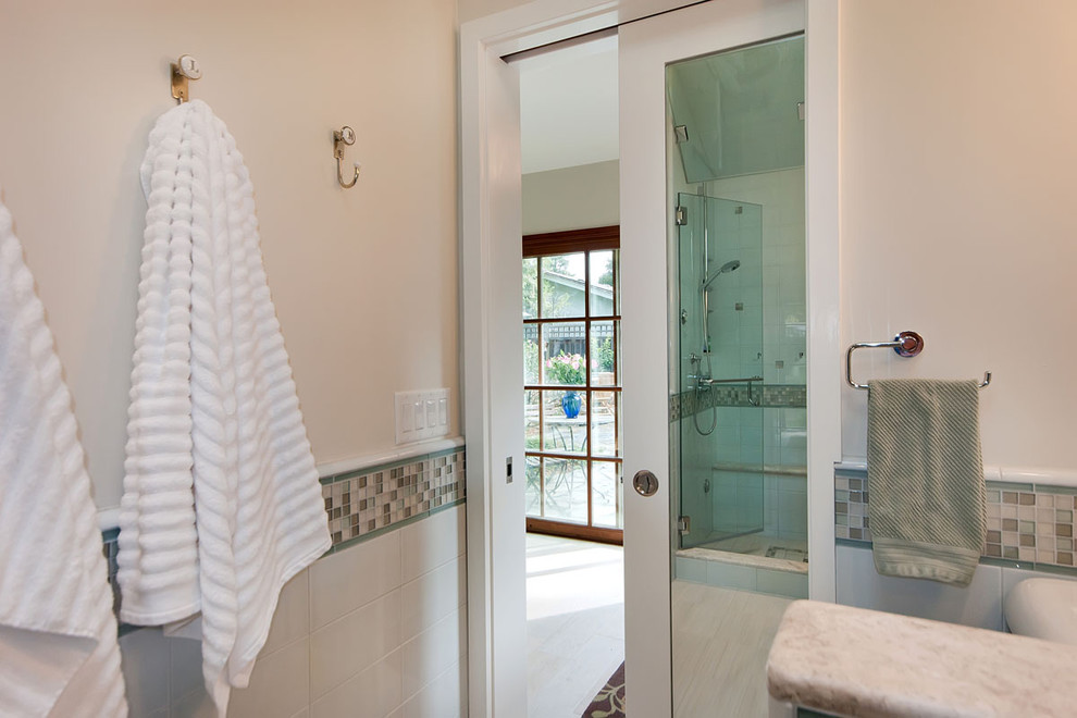 This is an example of a mid-sized contemporary bathroom in San Francisco with an alcove shower, porcelain tile, beige walls, with a sauna and a hinged shower door.