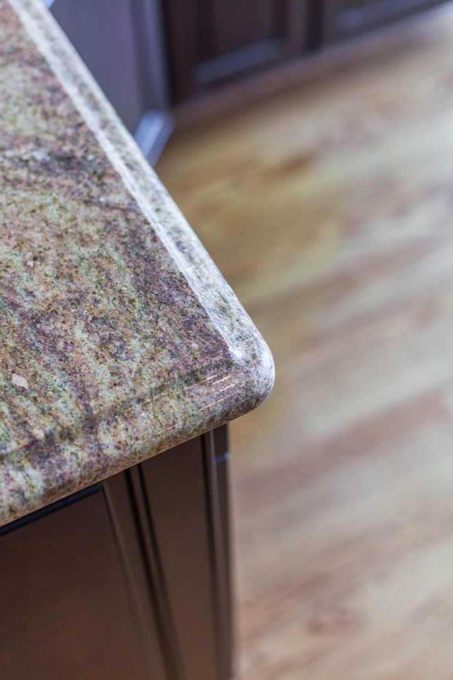 Inspiration for a huge transitional medium tone wood floor eat-in kitchen remodel in DC Metro with raised-panel cabinets, granite countertops, stainless steel appliances and an island