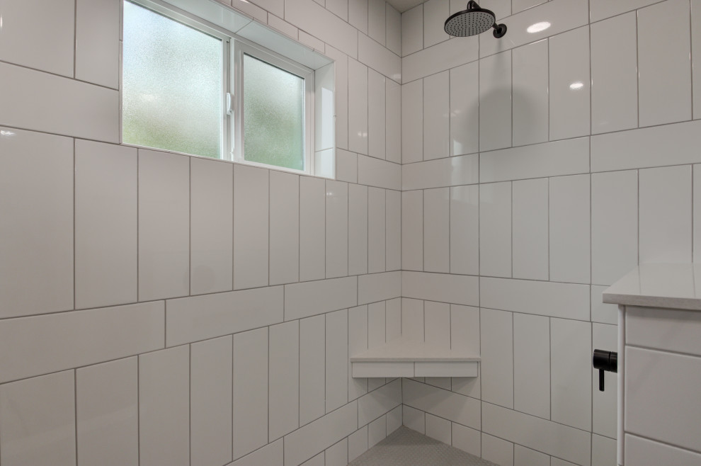 Freestanding bathtub - mid-sized transitional master white tile and subway tile double-sink freestanding bathtub idea in Phoenix with shaker cabinets, brown cabinets, an undermount sink, quartz countertops, white countertops and a built-in vanity