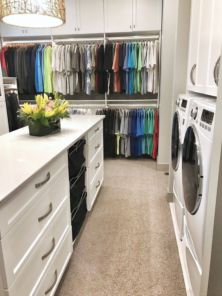 Inspiration for a large transitional walk-in wardrobe in Other with flat-panel cabinets, white cabinets, carpet and beige floor.