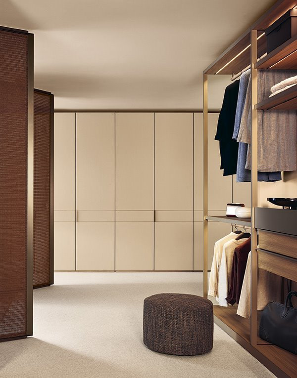 Large transitional built-in closet photo in DC Metro with flat-panel cabinets