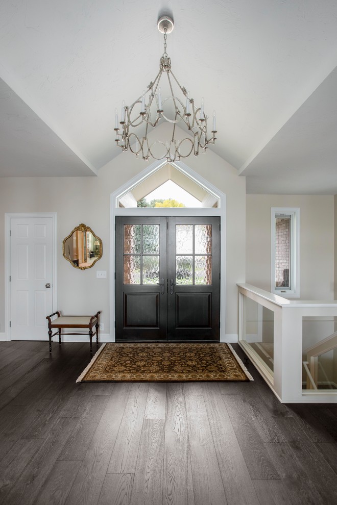 Front door - large transitional dark wood floor and brown floor front door idea in Minneapolis with beige walls and a dark wood front door