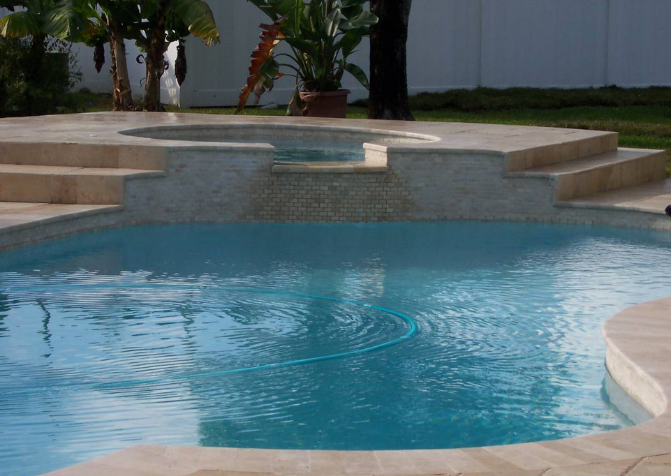 Inspiration for a transitional backyard tile and custom-shaped natural hot tub remodel in Miami