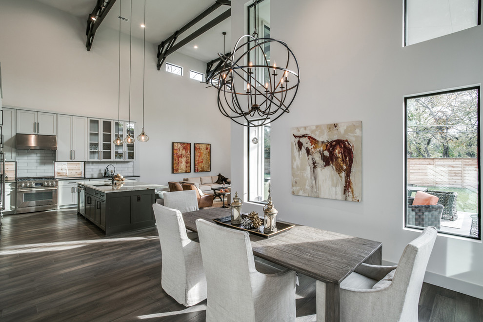 Transitional dining room in Dallas with white walls, dark hardwood floors and brown floor.