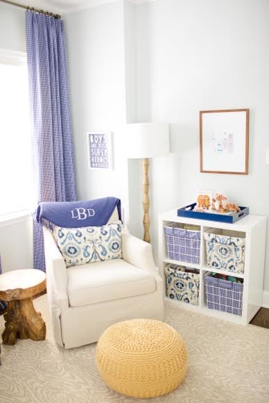 Small transitional nursery in Atlanta with blue walls and dark hardwood floors for boys.