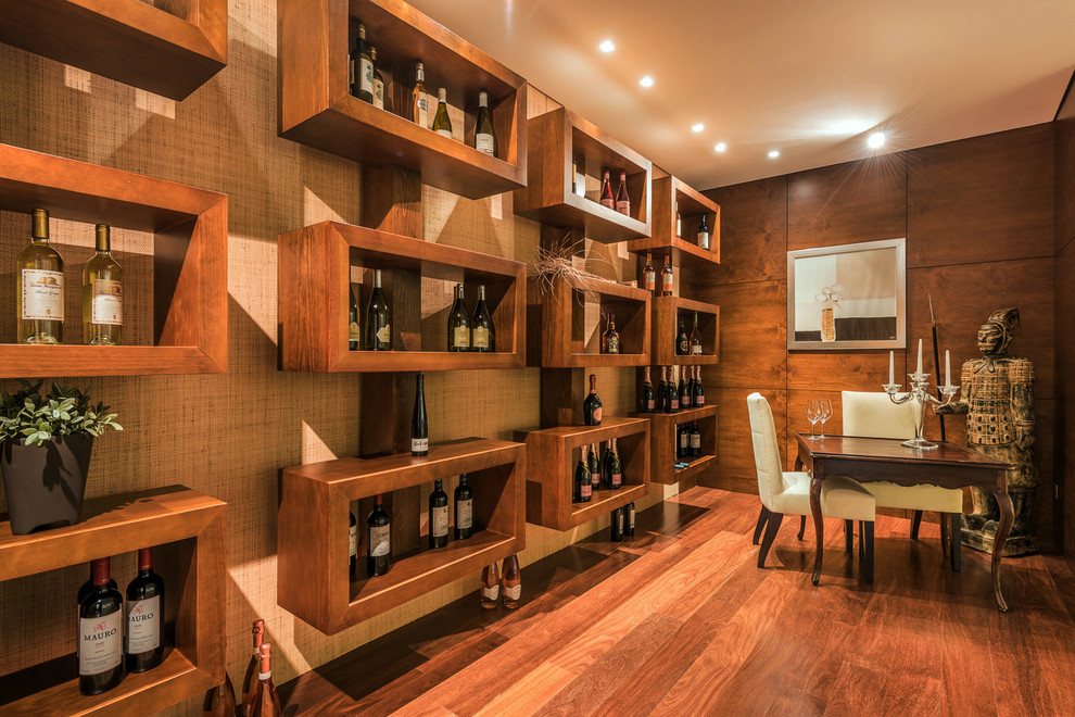 Inspiration for a large asian wine cellar in Malaga with medium hardwood floors and brown floor.