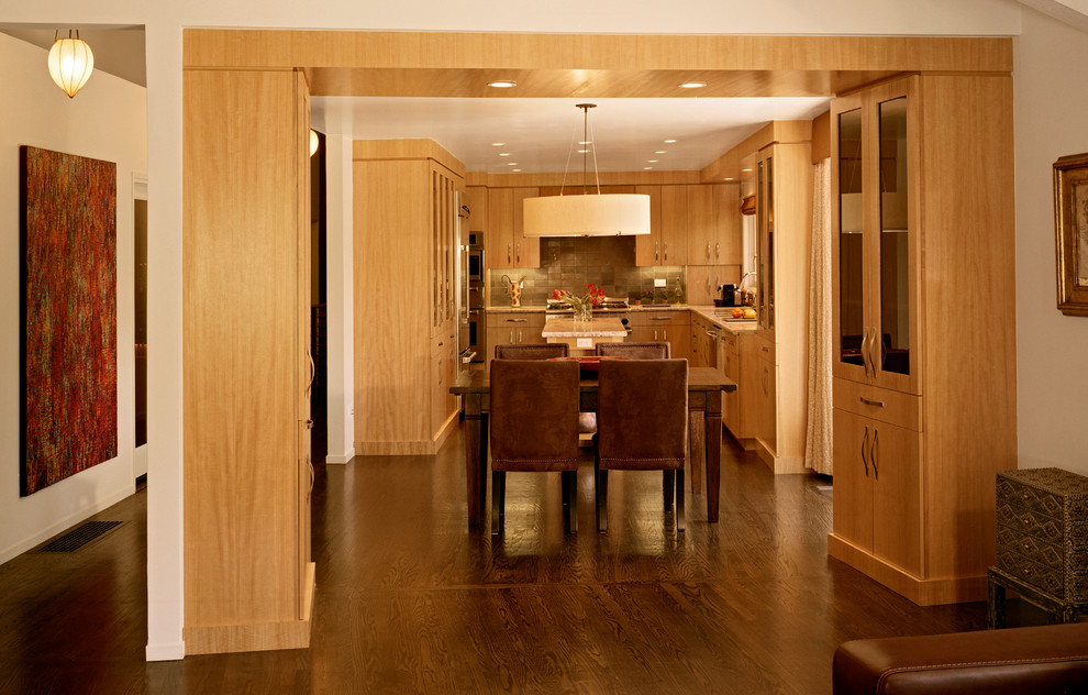 Photo of a mid-sized modern open plan dining in San Francisco with white walls, dark hardwood floors and brown floor.