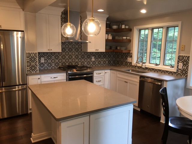 Statement Patterned-Tile Backsplash in a Contemporary, Neutral Kitchen