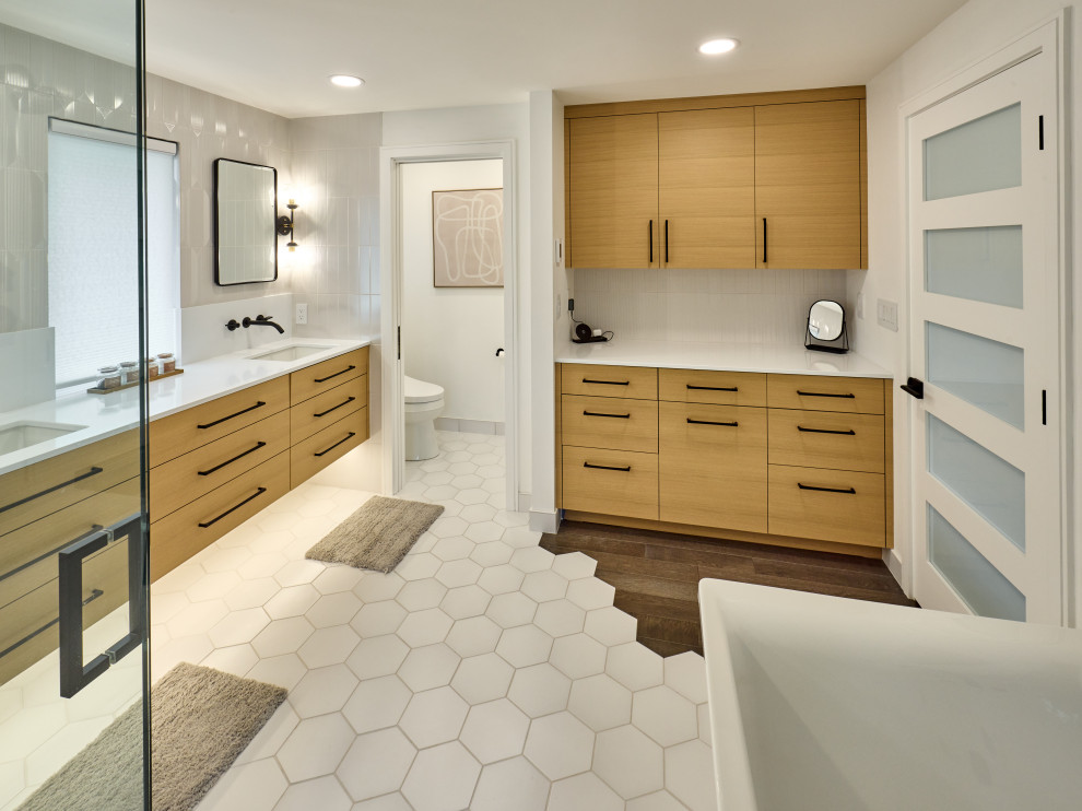 Mid-sized minimalist master white tile cement tile floor, white floor and double-sink bathroom photo in Other with flat-panel cabinets, medium tone wood cabinets, a one-piece toilet, white walls, an undermount sink, quartzite countertops, a hinged shower door, white countertops and a floating vanity