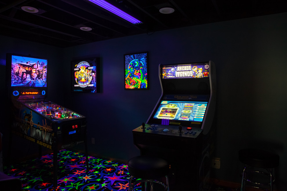 Basement - large transitional walk-out carpeted and multicolored floor basement idea in Cincinnati with blue walls, a standard fireplace and a brick fireplace