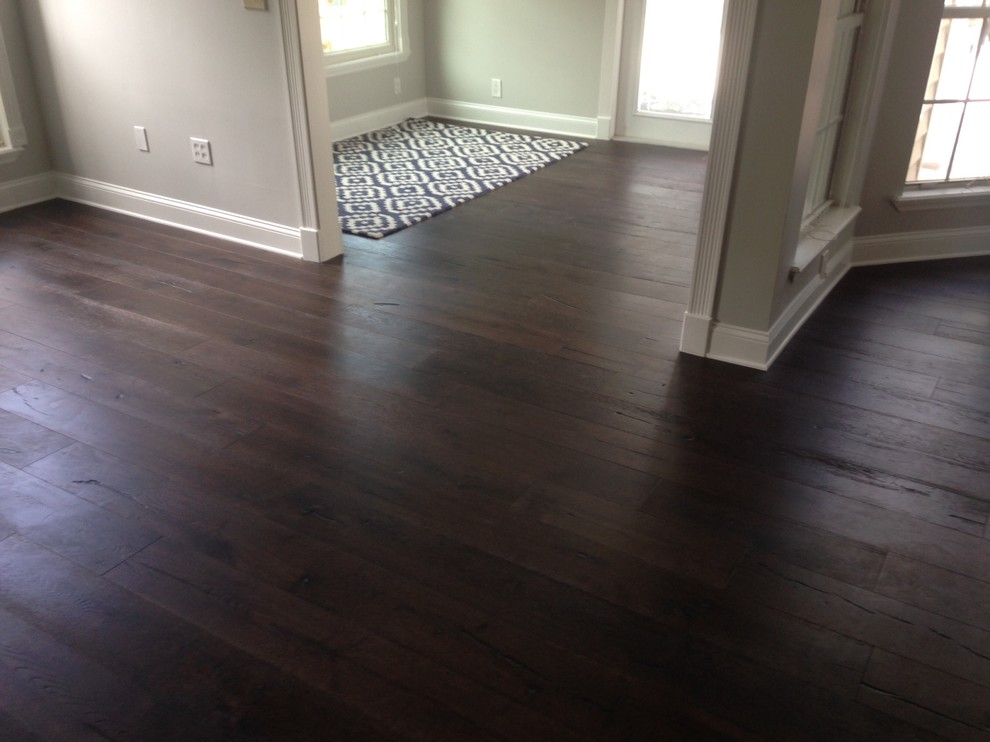 Inspiration for a contemporary hallway in Jacksonville with dark hardwood floors.