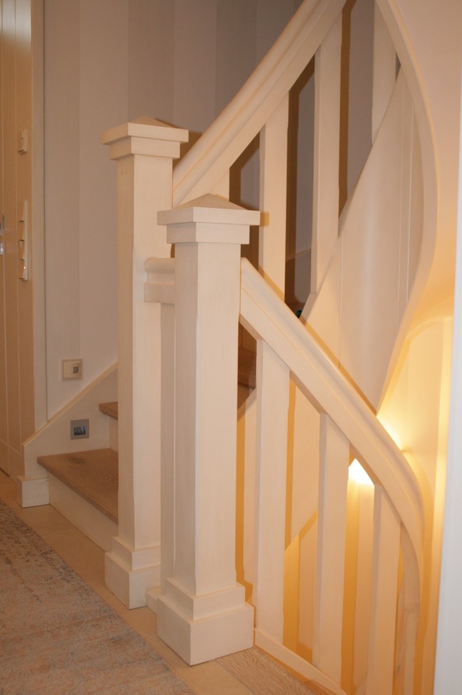 Design ideas for a small country wood curved staircase in Other with wood risers.