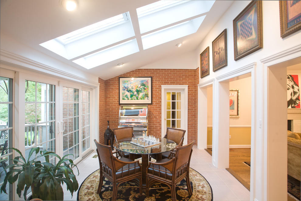 Inspiration for a traditional family room in DC Metro with a game room and white walls.