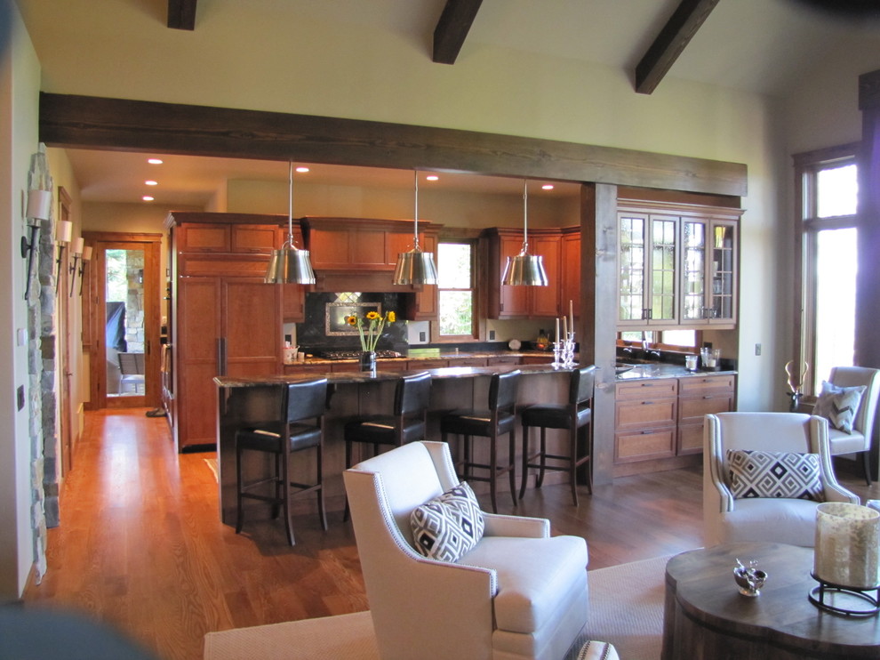 Kitchen - large transitional u-shaped medium tone wood floor kitchen idea with an undermount sink, recessed-panel cabinets, medium tone wood cabinets, granite countertops, multicolored backsplash, ceramic backsplash, paneled appliances and a peninsula