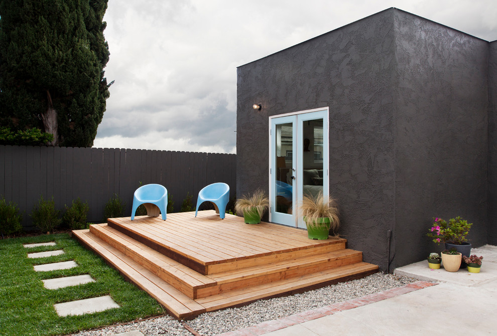 This is an example of a scandinavian courtyard deck in Los Angeles with a container garden and no cover.