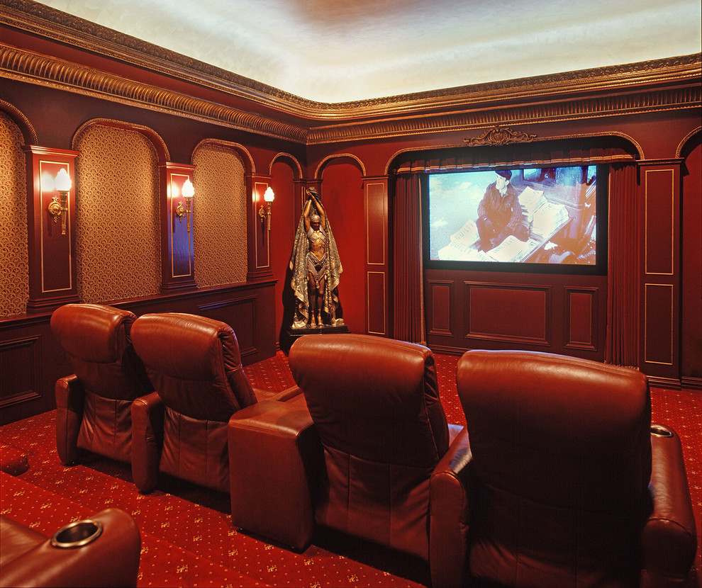 This is an example of a large traditional enclosed home theatre in Charlotte with red walls, carpet, red floor and a built-in media wall.