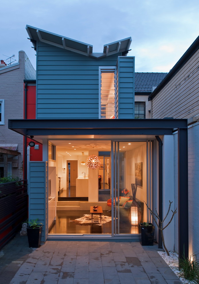 This is an example of a contemporary blue exterior in Sydney.