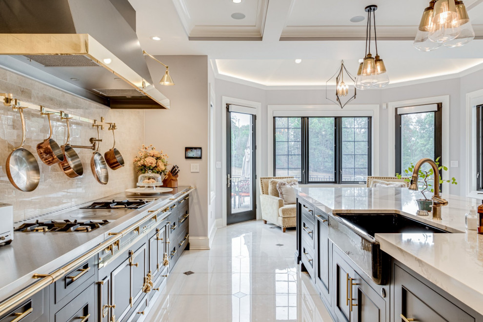 Design ideas for an expansive mediterranean galley eat-in kitchen in Other with a farmhouse sink, beaded inset cabinets, black cabinets, quartz benchtops, beige splashback, marble splashback, black appliances, marble floors, with island, multi-coloured floor and beige benchtop.