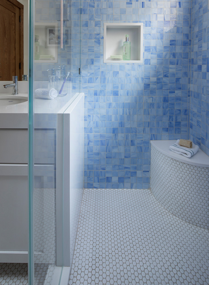 This is an example of a medium sized traditional family bathroom in San Francisco with shaker cabinets, white cabinets, an alcove shower, blue tiles, mosaic tiles, white walls, marble flooring, a submerged sink, marble worktops, white floors, a hinged door, white worktops, a shower bench, a single sink, a built in vanity unit and a drop ceiling.
