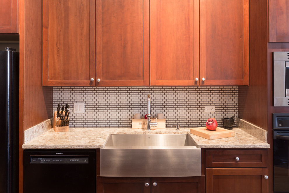 Example of a mid-sized trendy galley enclosed kitchen design in Chicago with an undermount sink, granite countertops, white backsplash, cement tile backsplash and stainless steel appliances