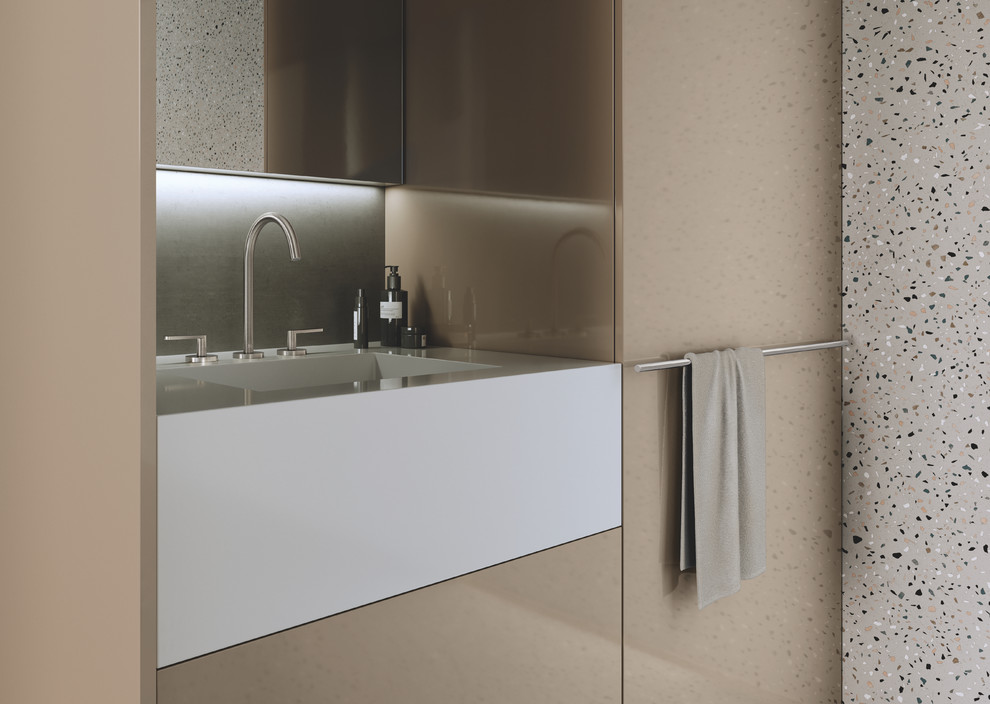 Photo of a mid-sized modern 3/4 bathroom in Dortmund with flat-panel cabinets, beige cabinets, an open shower, multi-coloured tile, white walls, an integrated sink, multi-coloured floor and white benchtops.