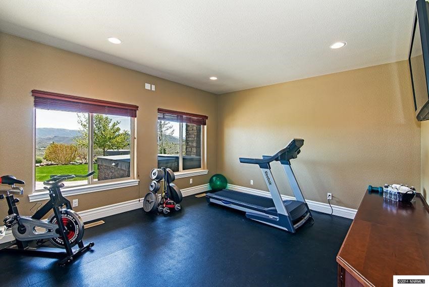 Mid-sized modern home weight room in Other with beige walls.