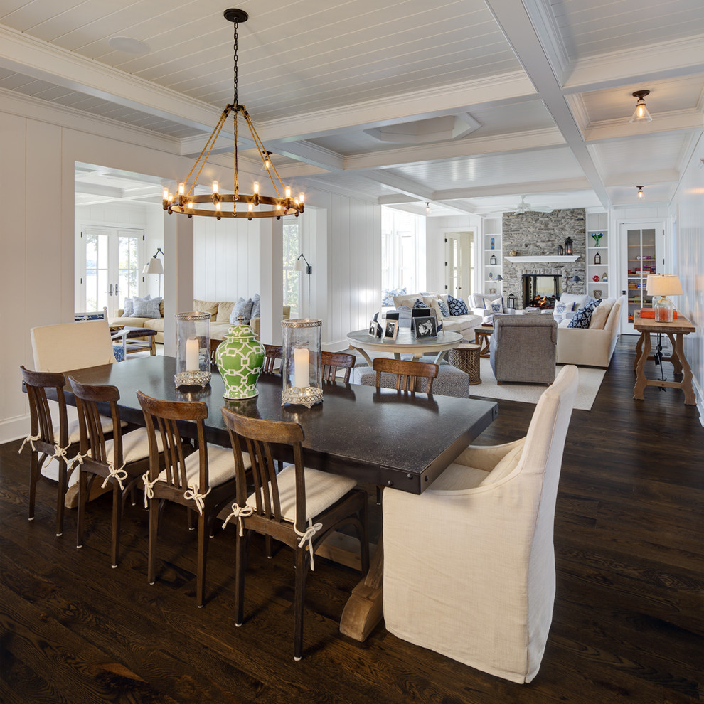 Beach style open plan dining in Milwaukee with white walls and dark hardwood floors.