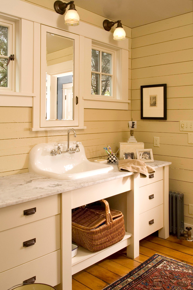 Photo of a traditional bathroom in Seattle with marble benchtops.