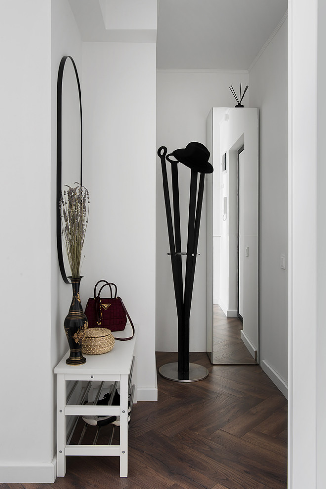 Entryway - small contemporary laminate floor and brown floor entryway idea in Moscow with white walls