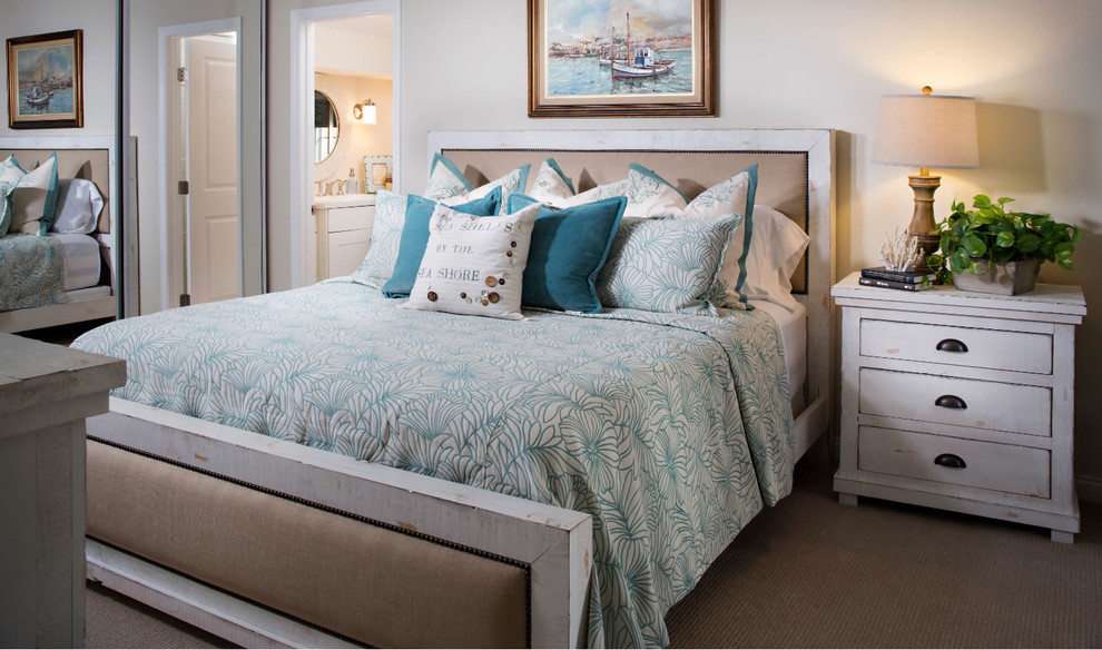 Mid-sized beach style guest bedroom in San Diego with white walls and carpet.