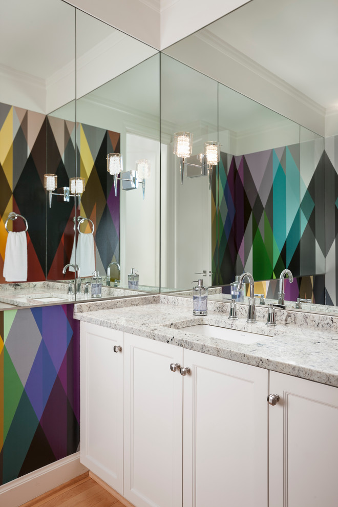 This is an example of a mid-sized contemporary master bathroom in Seattle with an undermount sink, recessed-panel cabinets, white cabinets, multi-coloured walls and medium hardwood floors.