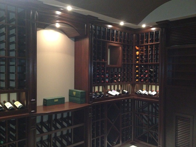 Inspiration for a mid-sized contemporary wine cellar in Toronto with ceramic floors, storage racks and white floor.