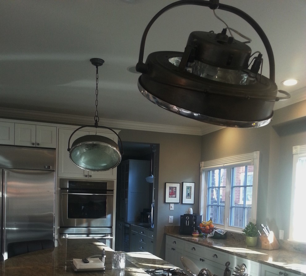 Large transitional u-shaped dark wood floor eat-in kitchen photo in Denver with shaker cabinets, white cabinets, stainless steel appliances and an island