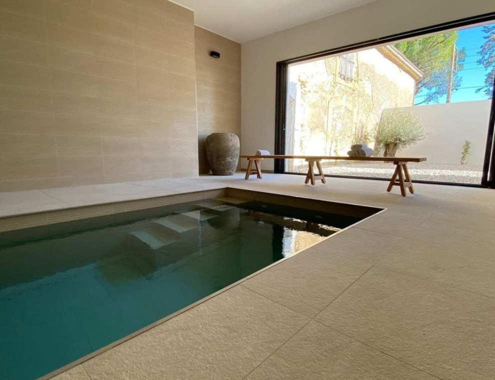 Pool - mid-sized modern indoor tile and rectangular pool idea in Montpellier