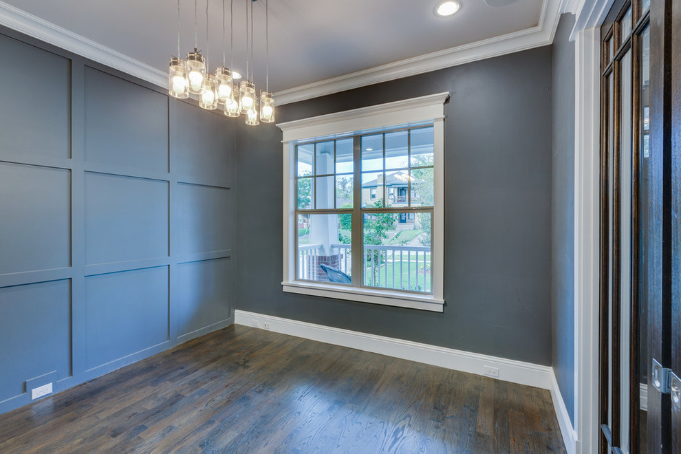 Design ideas for a mid-sized arts and crafts study room in Dallas with grey walls and medium hardwood floors.
