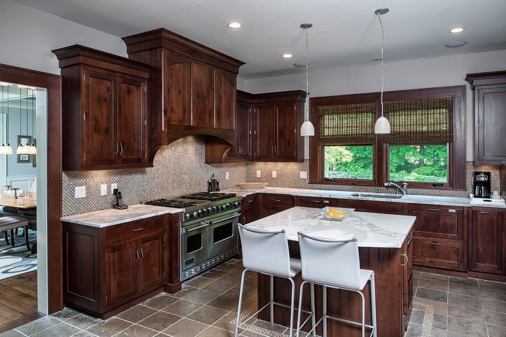 Enclosed kitchen - mid-sized transitional l-shaped ceramic tile enclosed kitchen idea in New York with a drop-in sink, dark wood cabinets, marble countertops, gray backsplash, stainless steel appliances, an island, shaker cabinets and mosaic tile backsplash