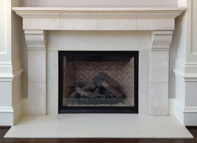 Fireplace mantel made to resemble French limestone using plaster with grout lines incised and aging glazes applied.