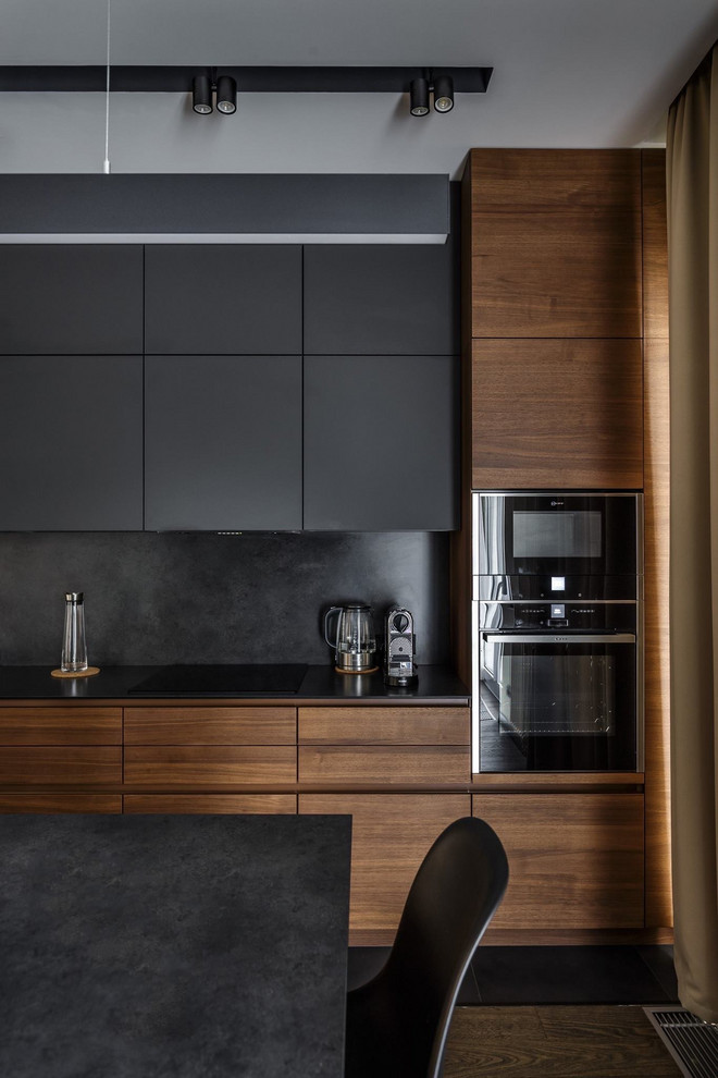 Mid-sized contemporary eat-in kitchen in Moscow with an undermount sink, flat-panel cabinets, dark hardwood floors and with island.