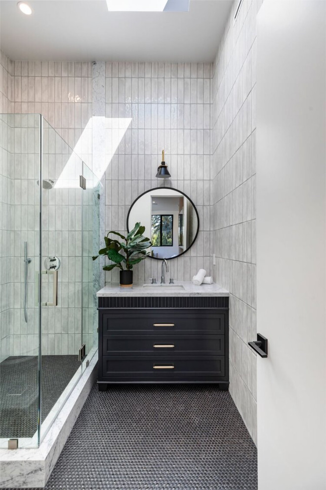 Large contemporary shower room bathroom in Los Angeles with louvered cabinets, medium wood cabinets, a corner shower, a one-piece toilet, grey tiles, porcelain tiles, marble flooring, a submerged sink, marble worktops, white floors, a hinged door, white worktops, a freestanding vanity unit and a single sink.