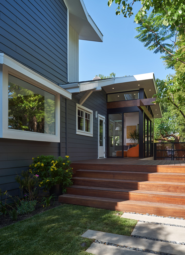 Example of a mid-sized trendy backyard tile patio design in Los Angeles with no cover