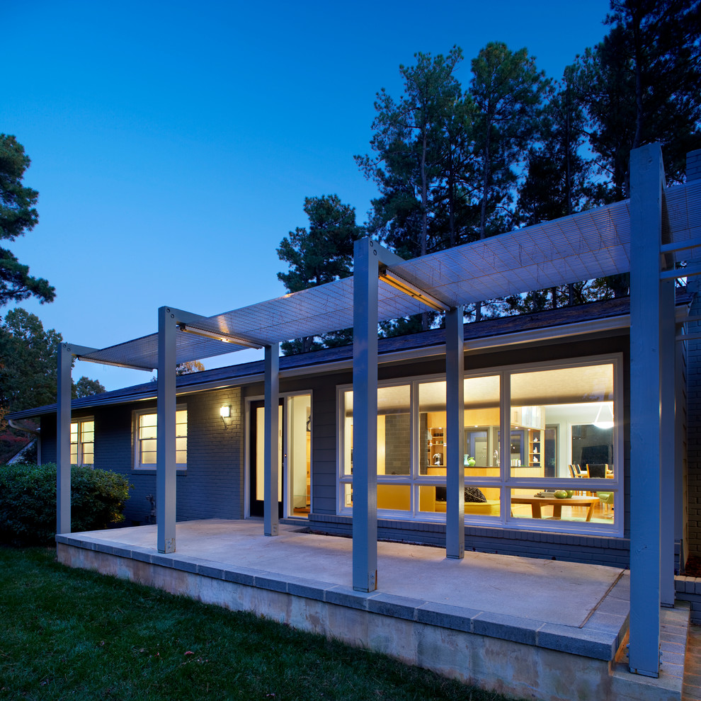 Inspiration for a contemporary verandah in Raleigh with a pergola.