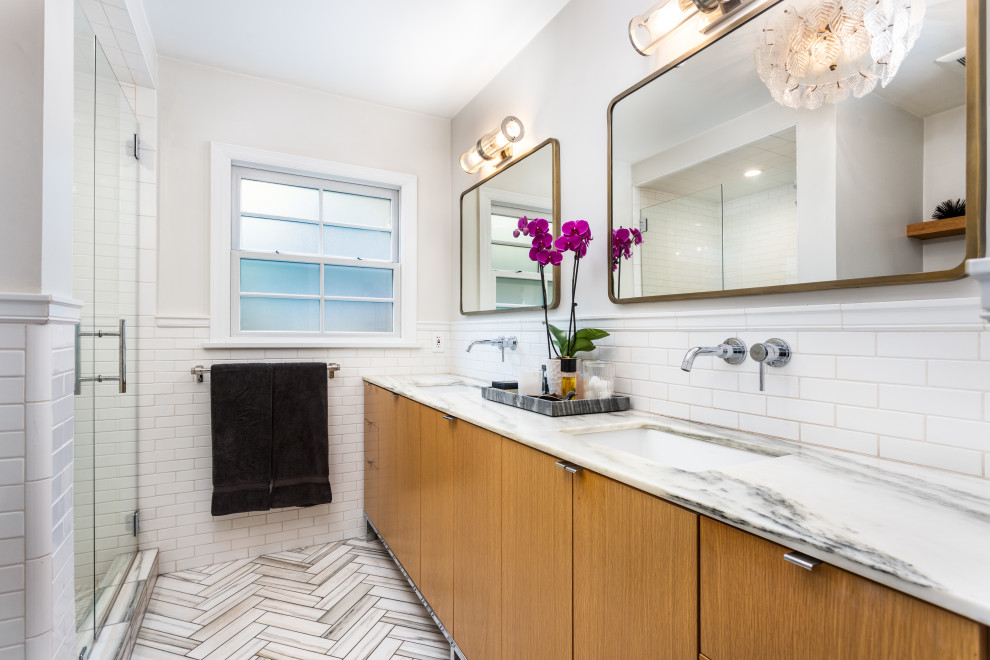 Photo of a small country master bathroom in Los Angeles with flat-panel cabinets, brown cabinets, an alcove shower, white tile, subway tile, white walls, an undermount sink, engineered quartz benchtops, multi-coloured floor, a hinged shower door, multi-coloured benchtops, a double vanity and a built-in vanity.