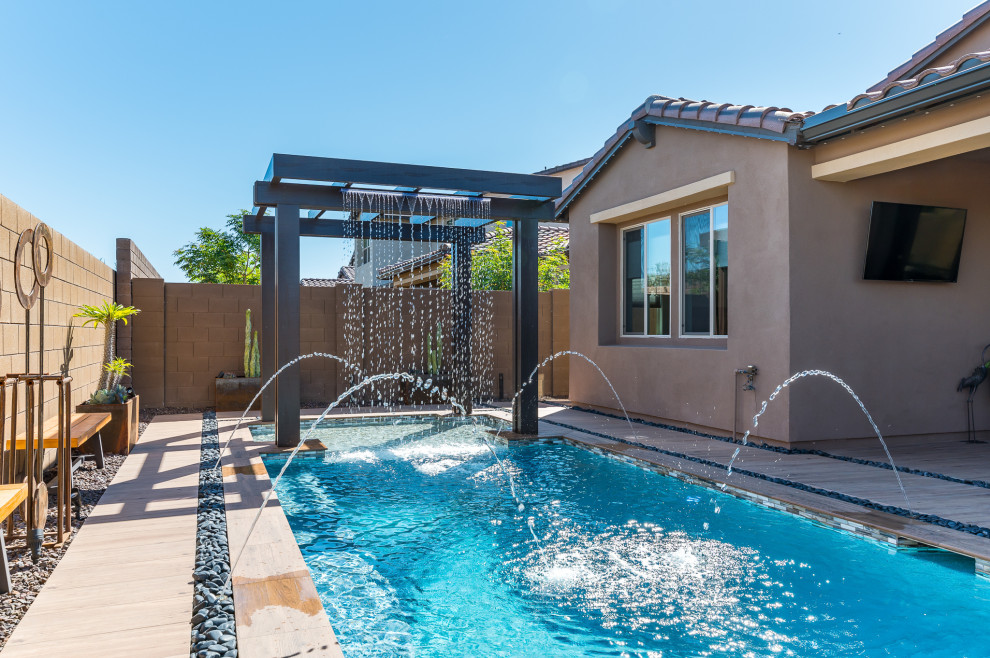 Inspiration for a small backyard tile and rectangular pool remodel in Phoenix