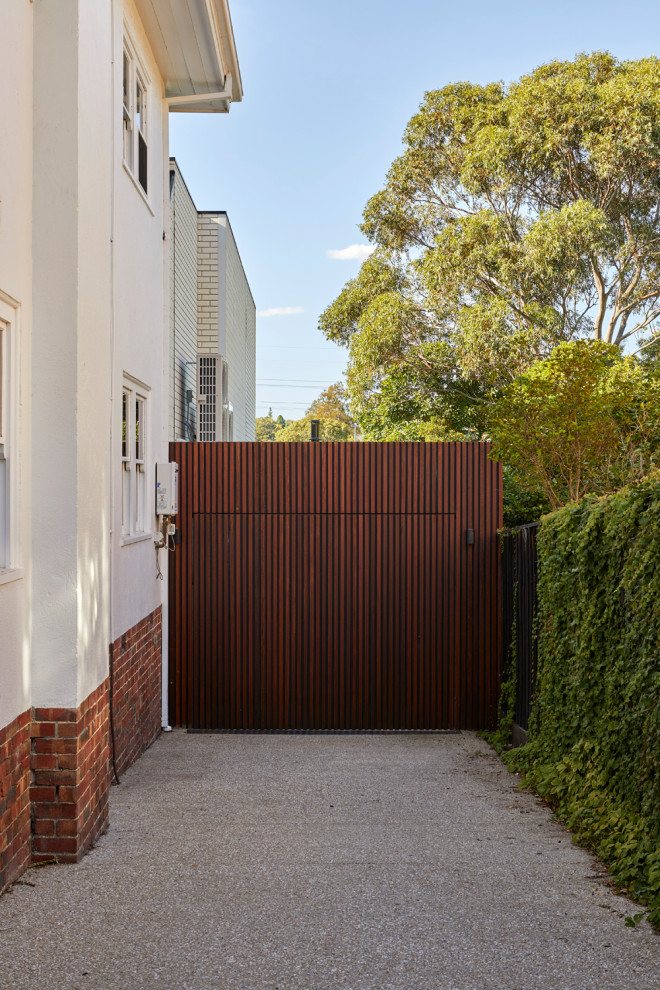 Design ideas for a small contemporary attached single garage in Melbourne.